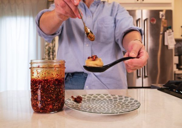 Chili Oil being used on a dumpling